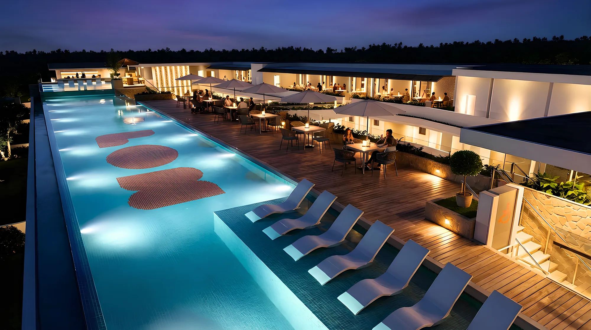 Piscina del complejo de El Nido al anochecer con la zona de hamacas (render)