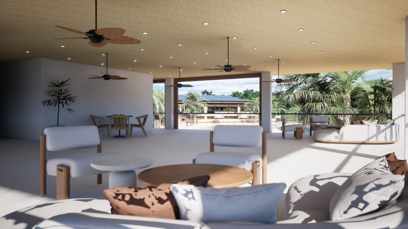Salón abierto de las eco-villas con vistas a la piscina y a las palmeras del complejo