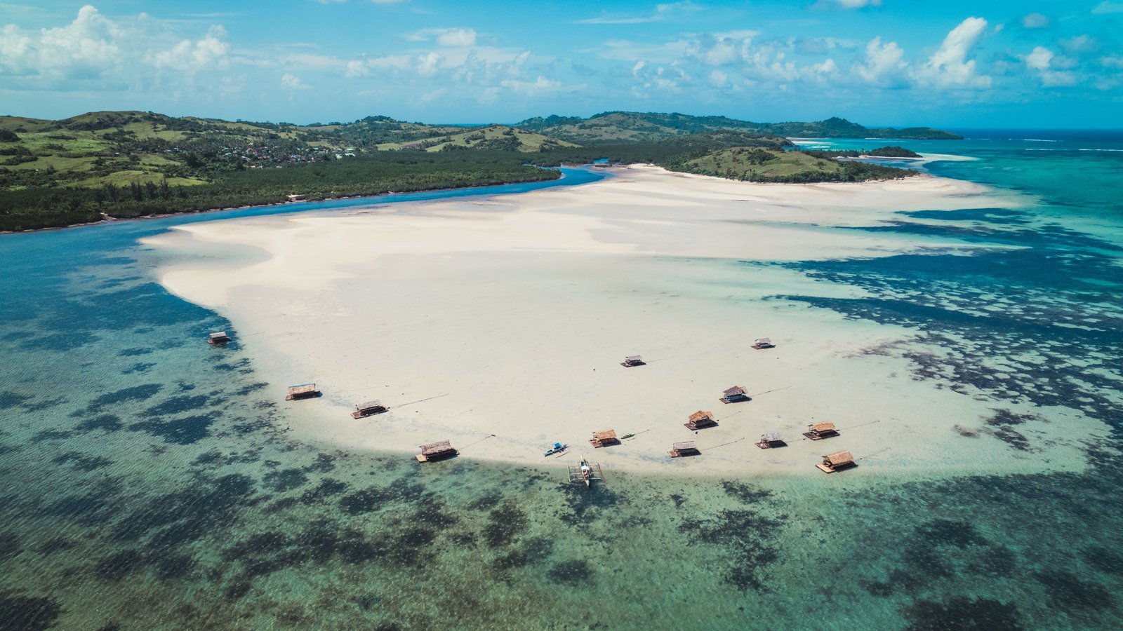 Aerial view of a white sandbank and shallow turquoise water
